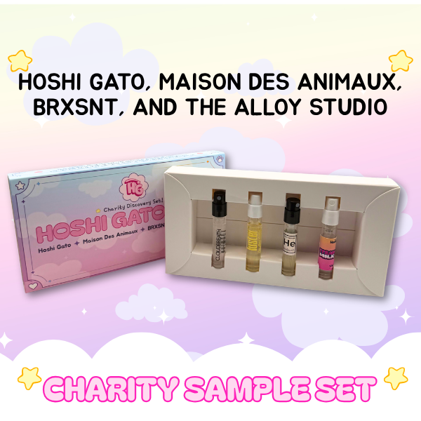 Set of perfume samples in a display box with packaging labeled 'Hoshi Gatothon' on a pastel background.