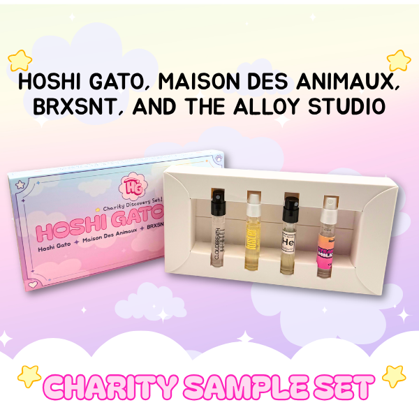 Set of perfume samples in a display box with packaging labeled 'Hoshi Gatothon' on a pastel background.