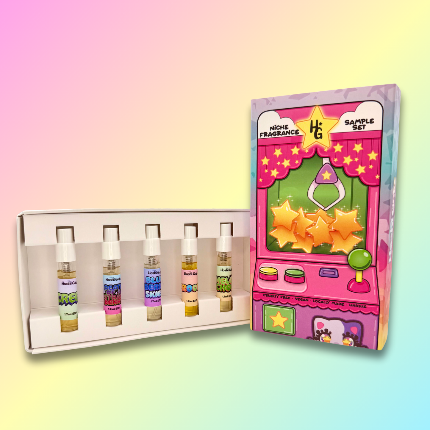 Set of samples with colorful labels next to a pink toy machine-themed box on a gradient background