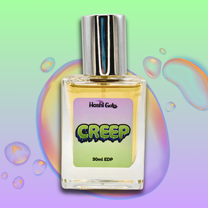 Perfume bottle labeled 'Creep' on a colorful bubble background