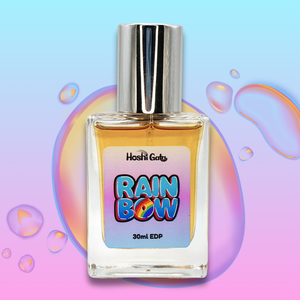 Perfume bottle labeled 'Rainbow' on a colorful abstract background