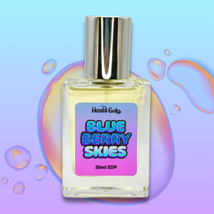 Perfume bottle labeled 'Blue Berry Skies'  on a colorful abstract background
