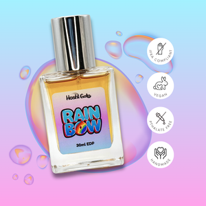 Rainbow on a colorful background with tags stating it is IFRA compliant, vegan, handmade, and phthalate-free.