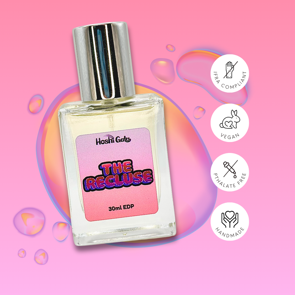 The Recluse on a colorful background with tags stating it is IFRA compliant, vegan, handmade, and phthalate-free.