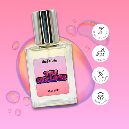 The Recluse on a colorful background with tags stating it is IFRA compliant, vegan, handmade, and phthalate-free.